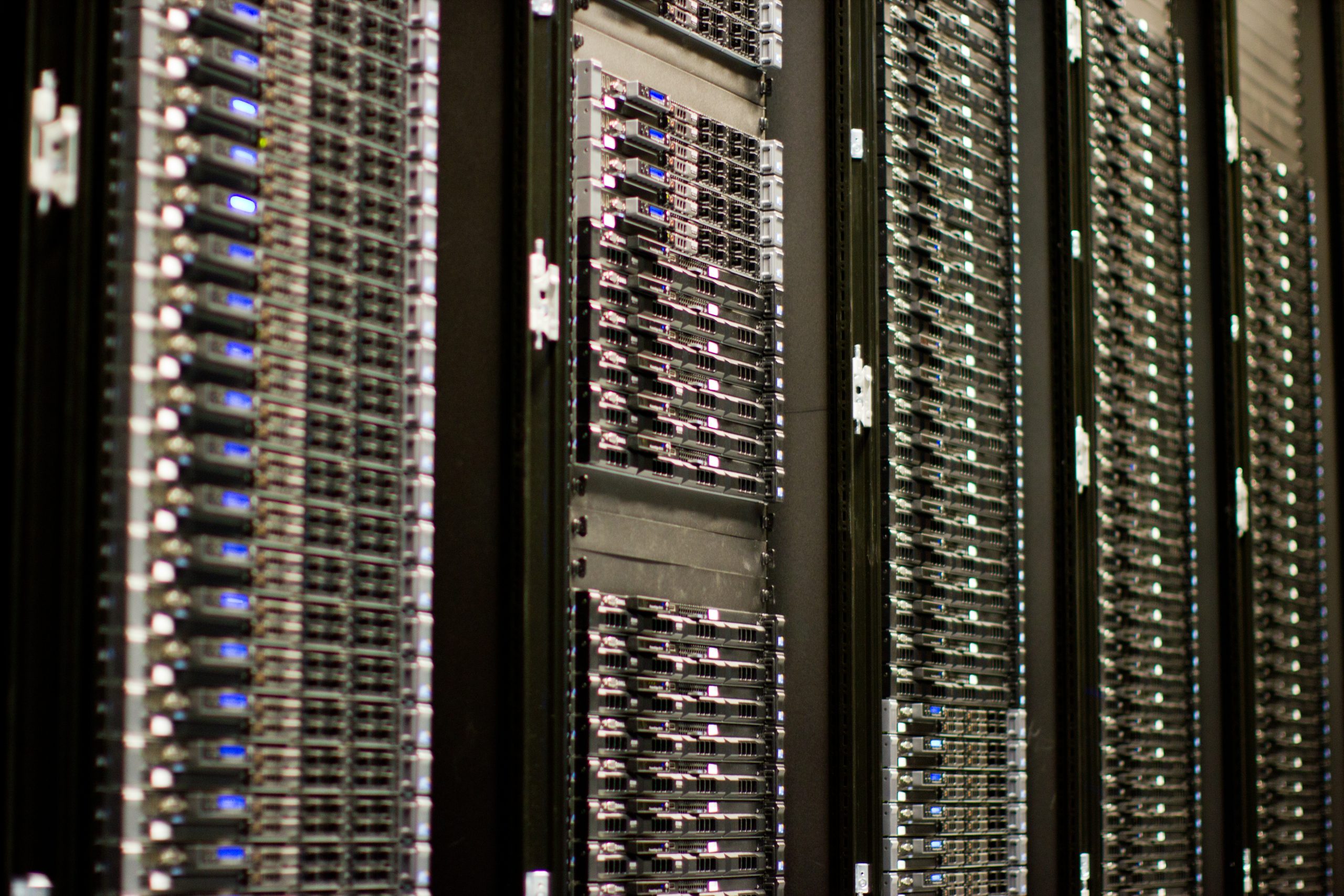 Rows of server racks with blinking lights in a data center